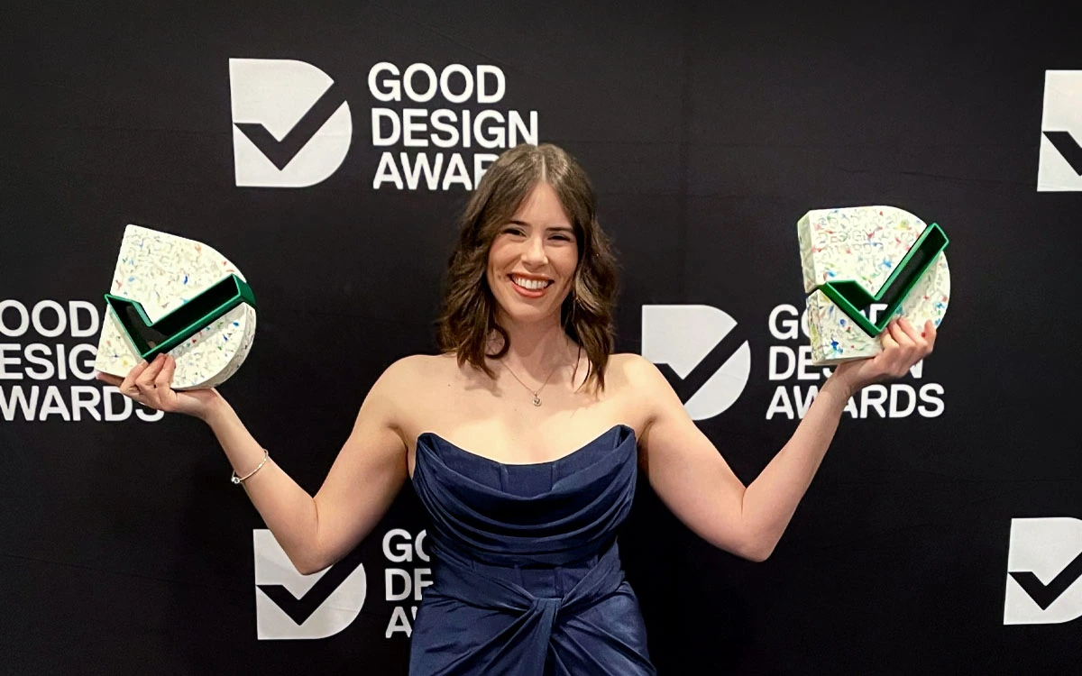 Brooke Royston holding Good Design Award Trophies